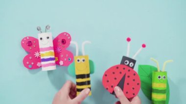 Kağıt işleri projesi. Boş tuvalet kağıtlarından yapılmış renkli böcekler.