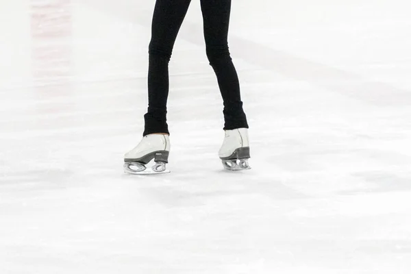 View of figure skater feet at the figure skating practice.