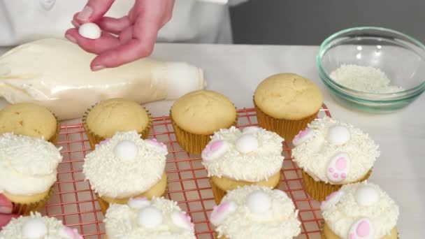 Flat Lay Decorating Vanilla Cupcakes White Buttercream Icing Bunny Ears — Stock Video