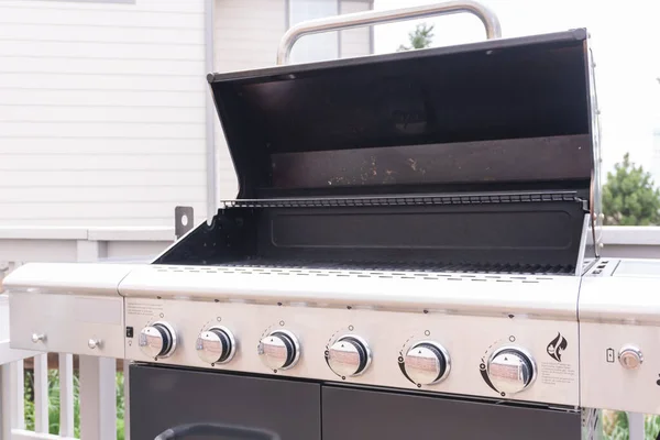 Clean six-burner gas grill ready for summer grilling.