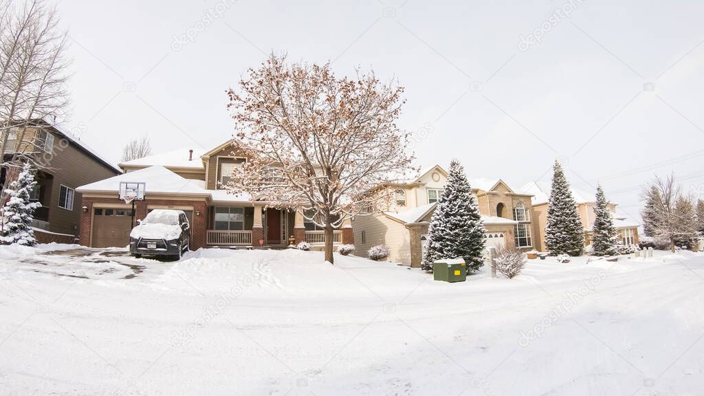 Denver, Colorado, USA-February 03, 2020 - Driving on typical paved roads in a suburban upscale residential neighborhood of America.