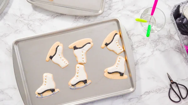 Flat Lay Decorating Ice Skate Shaped Sugar Cookies Black Color — Stock Photo, Image