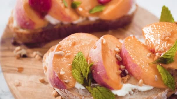 Peach Ricotta Toasts Garnished Walnuts Fresh Mint Raspberries — Stock Video