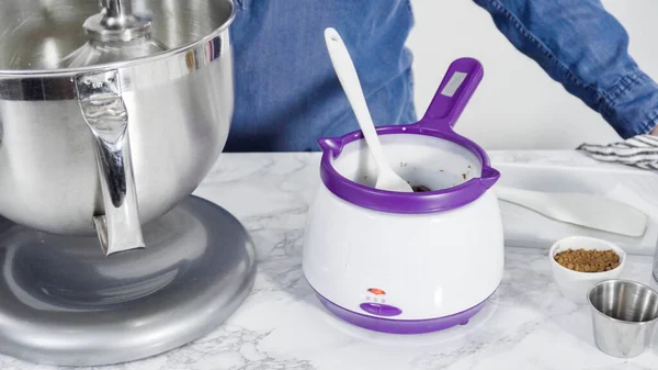 Step by step. Preparing homemade chocolate ice cream in a standing kitchen mixer.