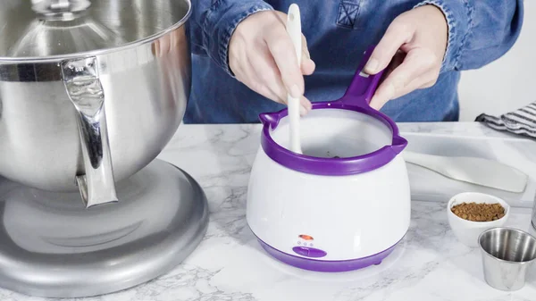 Step by step. Preparing homemade chocolate ice cream in a standing kitchen mixer.