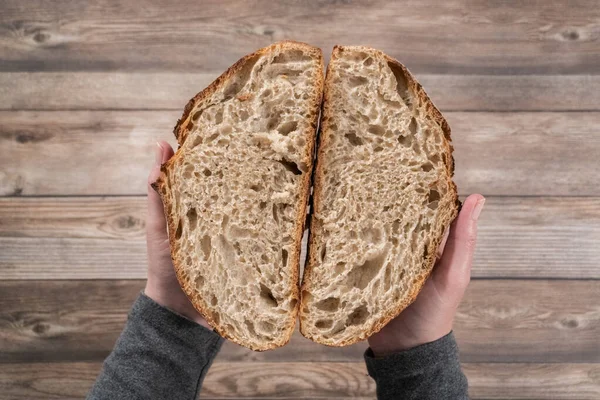 Flat lay. Sliced baked sourdough rye loaf of bread.