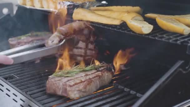 Grilling New York Steak Slice Butter Rosemary Outdoor Gas Grill — Stock Video