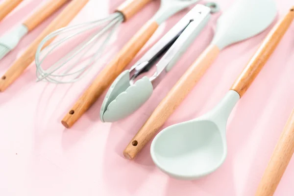 New Blue Silicone Kitchen Utensils Wooden Handles Pink Background — Stock Photo, Image