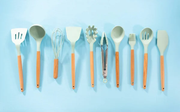 Flat Lay New Blue Silicone Kitchen Utensils Wooden Handles Blue — Stock Photo, Image