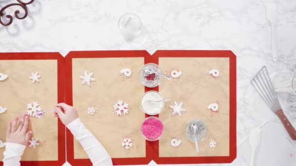 Making Large Clear Pink White Lollipops Snowflakes Sprinkles — Stock Video