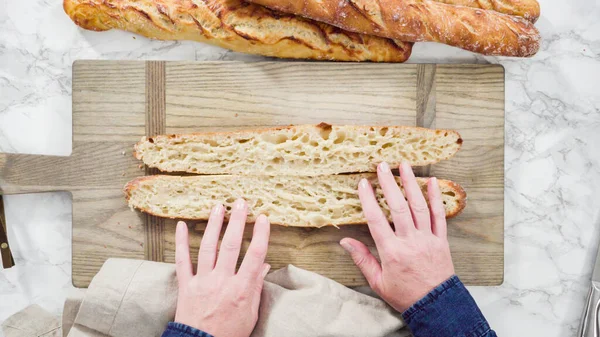 Flat lay. Freshly baked homemade French baguette bread.