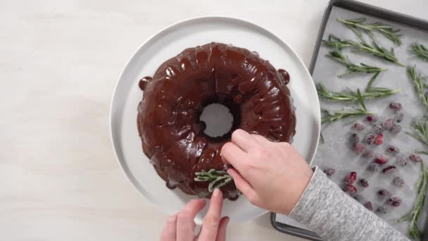 Making Chocolate Bundt Cake Chocolate Frosting Decorated Fresh Cranberries Rosemary — Stock Video