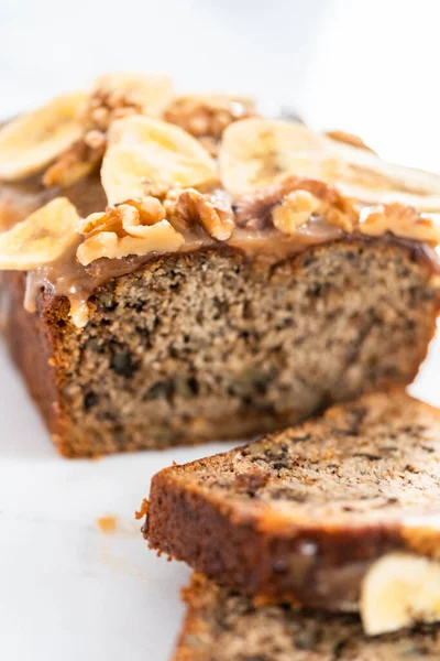 Sliced Banana Nut Bread Drizzled Homemade Caramel Marble Cutting Board — Stock Photo, Image