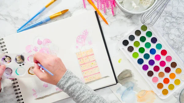 Acostado Baker Está Dibujando Diseño Pastel Cumpleaños Con Acuarelas —  Fotos de Stock