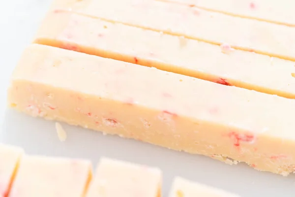Cutting Candy Cane Fudge Small Cubes — Stock Photo, Image