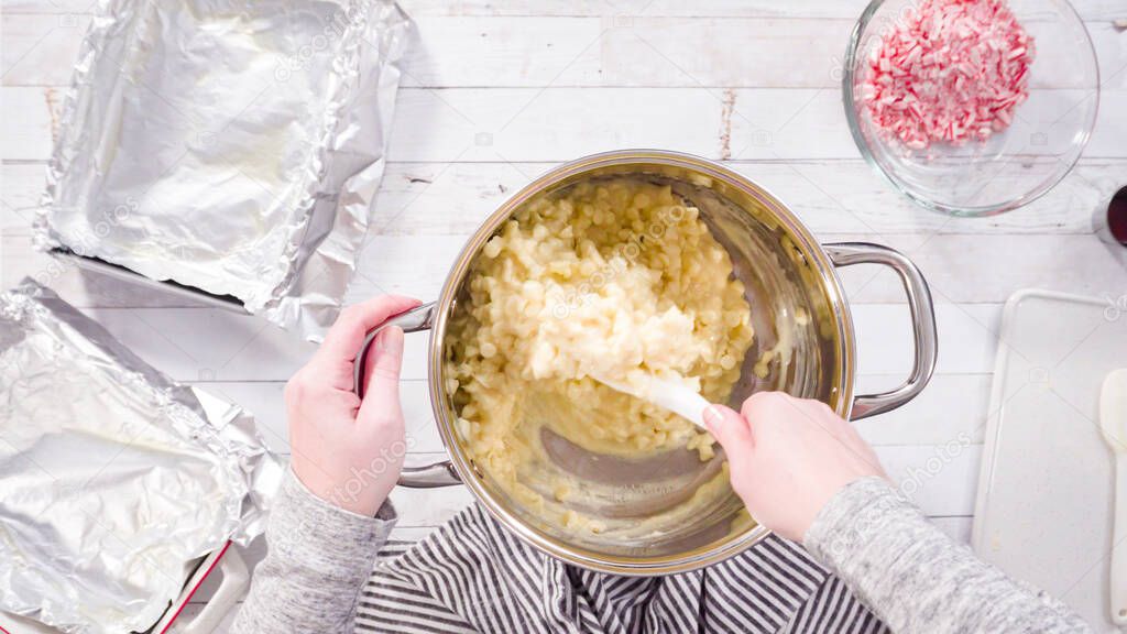 Flat lay. Step by step. Melting white chocolate chips in the cooking pot to make candy cane white chocolate fudge.