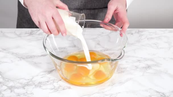 Adding Milk Bowl Raw Eggs Kitchen — Stock Video