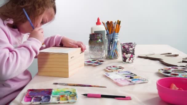 Little Girl Painting White Unicorn Acrylic Paint Wooden Box — Stock Video