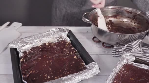 Scooping Melted Chocolate Baking Pans Lined Cooking Foil Make Macadamia — Stock Video