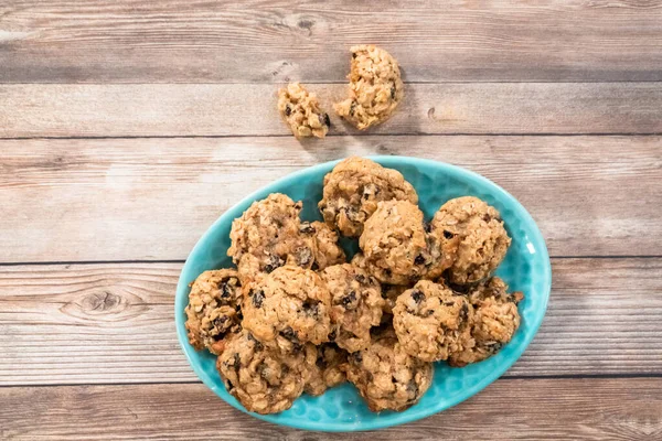 Flat Lay Freshly Baked Chewy Oatmeal Raisin Cookies Blue Plate — Stock Photo, Image