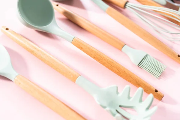New Blue Silicone Kitchen Utensils Wooden Handles Pink Background — Stock Photo, Image