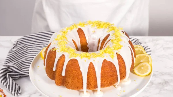 Step Step Garnishing Lemon Bundt Cake Lemon Zest Top White — Stock Photo, Image