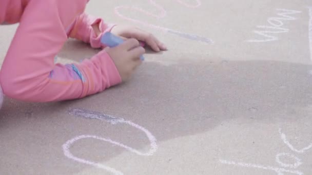 Little Girl Playing Chalk Driveway Front House — Stock Video