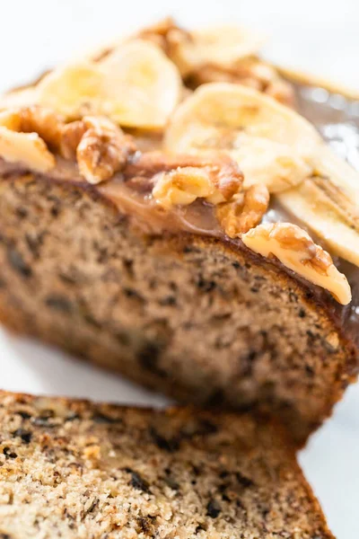 Sliced Banana Nut Bread Drizzled Homemade Caramel Marble Cutting Board — Stock Photo, Image