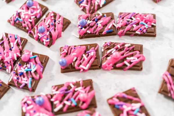 Gourmet Dark Mini Chocolates Drizzled Pink Chocolate Fancy Sprinkles Top — Stock Photo, Image