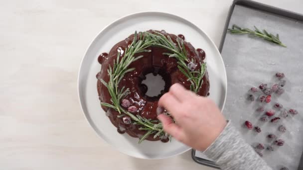 Sliced Chocolate Bundt Cake Chocolate Frosting Decorated Fresh Cranberries Rosemary — Stock Video