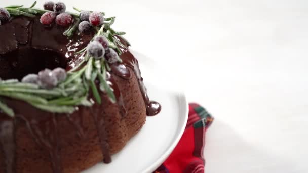 Sliced Chocolate Bundt Cake Chocolate Frosting Decorated Fresh Cranberries Rosemary — Stock Video