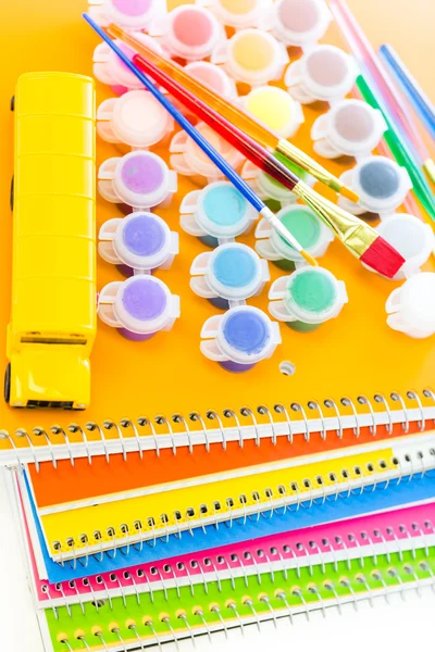 Paints, brushes and notebooks School supplies — Stock Photo, Image