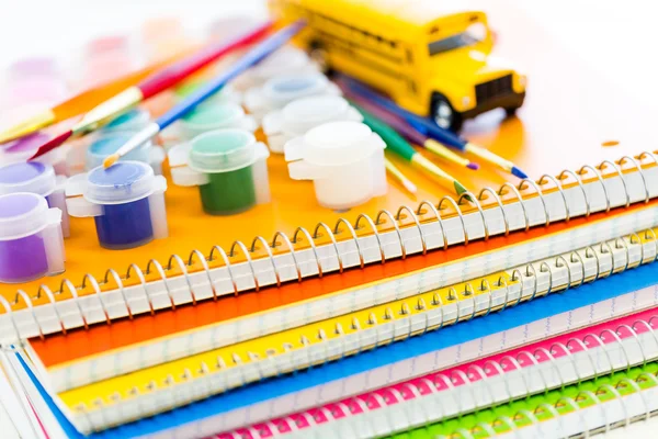 Paints, brushes and notebooks School supplies — Stock Photo, Image