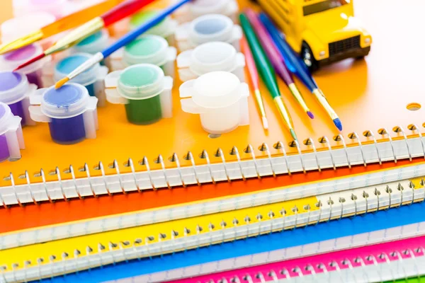 Paints, brushes and notebooks School supplies — Stock Photo, Image