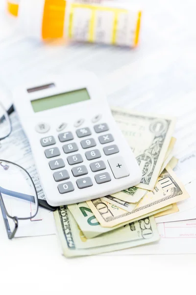 Calculator, cash and glasses - tax return — Stock Photo, Image