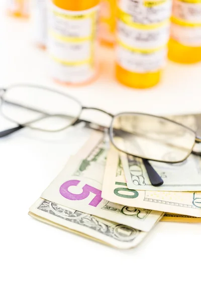 Prescription pills and dollar bills — Stock Photo, Image