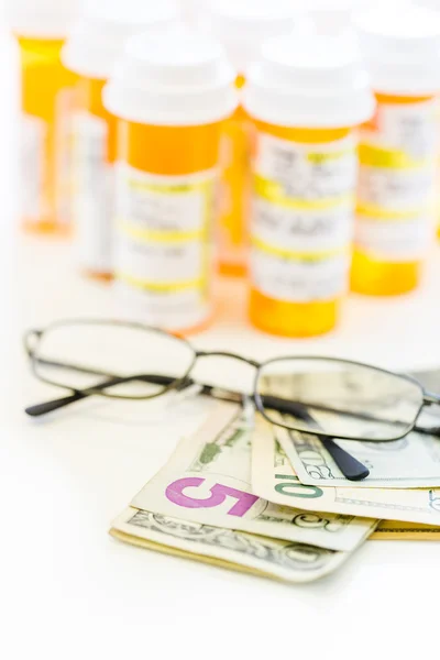 Prescription pills and dollar bills — Stock Photo, Image