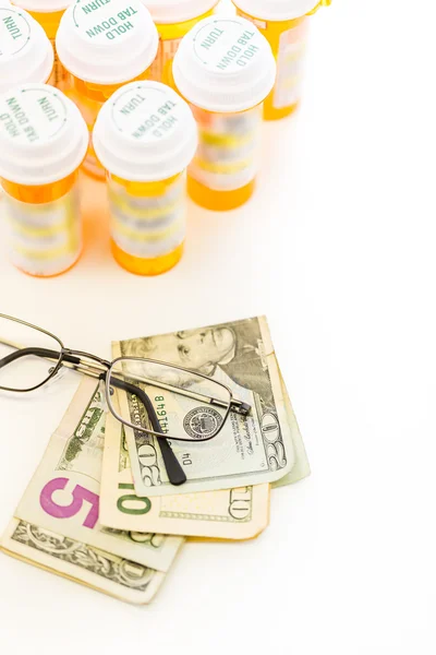 Prescription pills and dollar bills — Stock Photo, Image