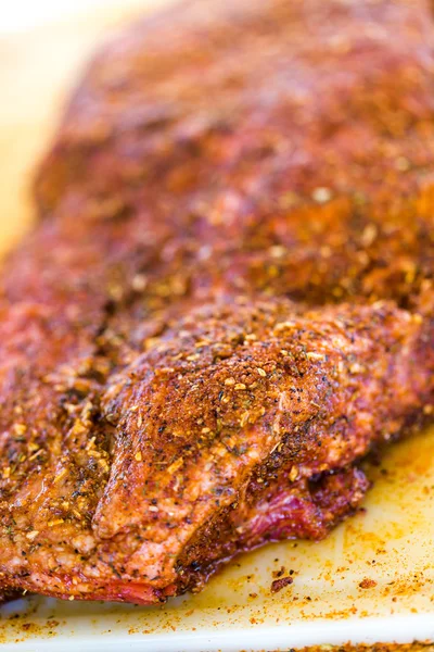 Slab of meat seasoned — Stock Photo, Image