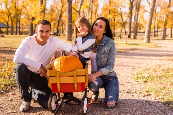 Family with pumpkins — Stock Photo, Image