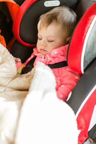 Baby girl sleeping in her car seat — Stock Photo, Image