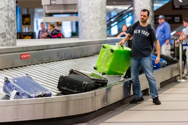 People at Baggage conveyor belt