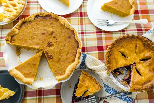 Homemade pies sliced on plates