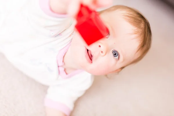 Cute baby girl with cubes — Stock Photo, Image