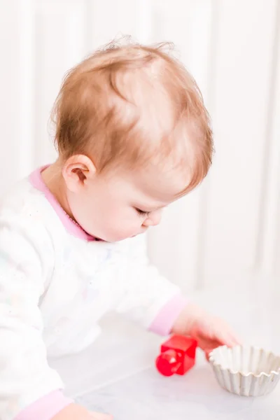 Cute baby girl with cubes — Stock Photo, Image