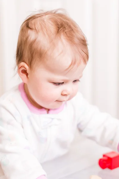 Cute baby girl with cubes — Stock Photo, Image