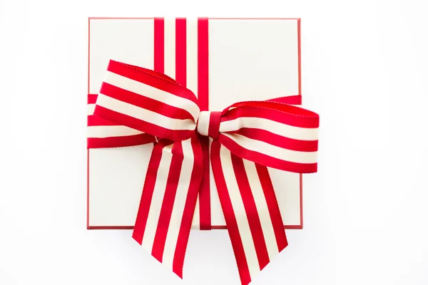 Box with red and white ribbon — Stock Photo, Image