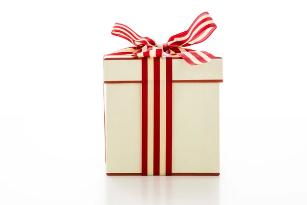 Box with red and white ribbon — Stock Photo, Image