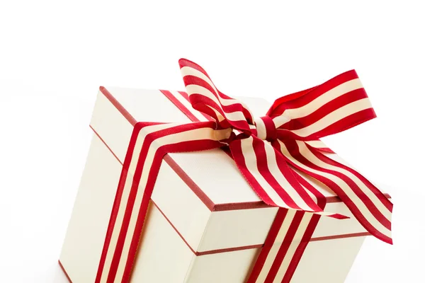 Box with red and white ribbon — Stock Photo, Image