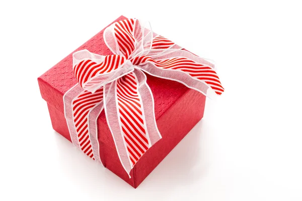 Box with red and white ribbon — Stock Photo, Image